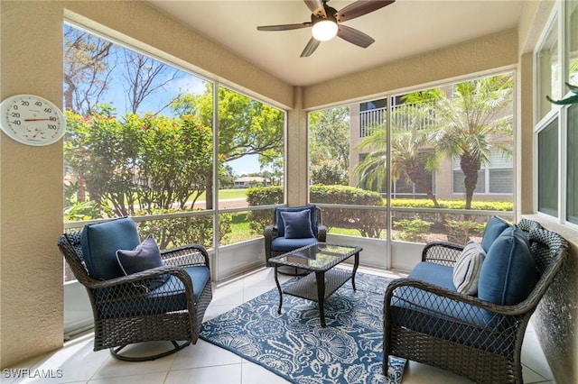 sunroom / solarium with a ceiling fan, an outdoor living space, and a healthy amount of sunlight