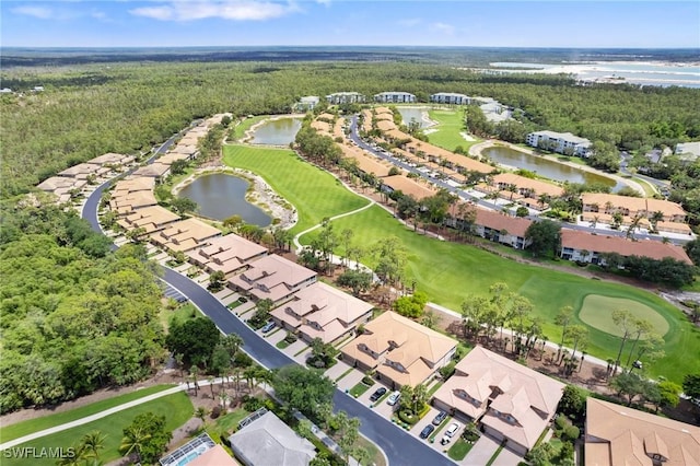 drone / aerial view with a residential view, a wooded view, a water view, and golf course view