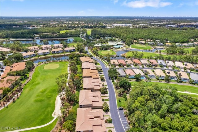 drone / aerial view with a water view, view of golf course, and a residential view