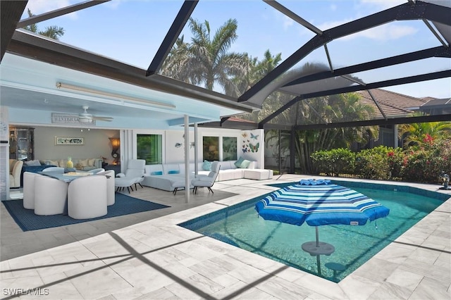 outdoor pool with outdoor lounge area, a lanai, and a patio area