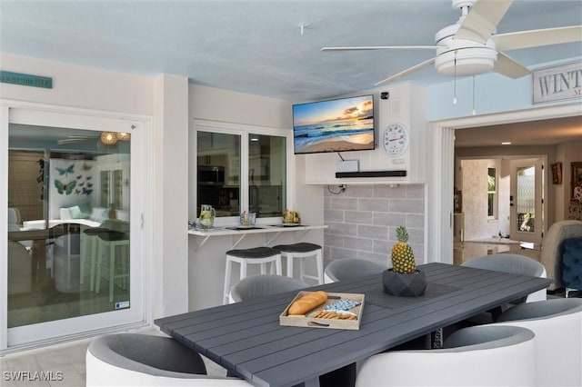 dining space with ceiling fan
