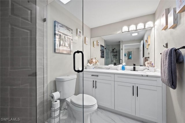 bathroom featuring a stall shower, vanity, toilet, and marble finish floor