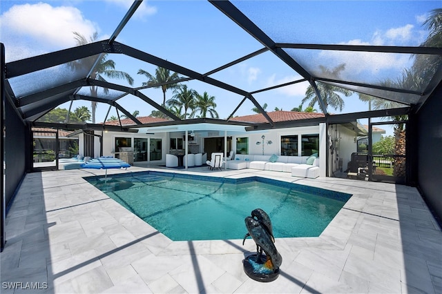 outdoor pool with an outdoor hangout area, a lanai, and a patio area