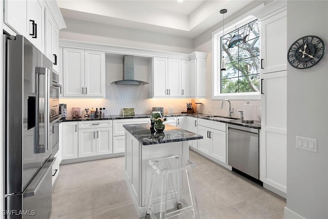 1603 Curlew Ave Unit 1603, Naples, FL 34102 - kitchen featuring a sink, wall chimney exhaust hood, backsplash, and stainless steel appliances