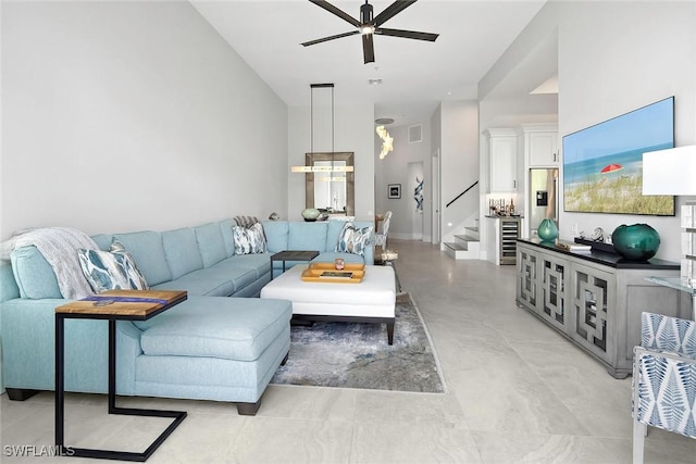 1603 Curlew Ave Unit 1603, Naples, FL 34102 - living area featuring a ceiling fan, visible vents, beverage cooler, and stairway
