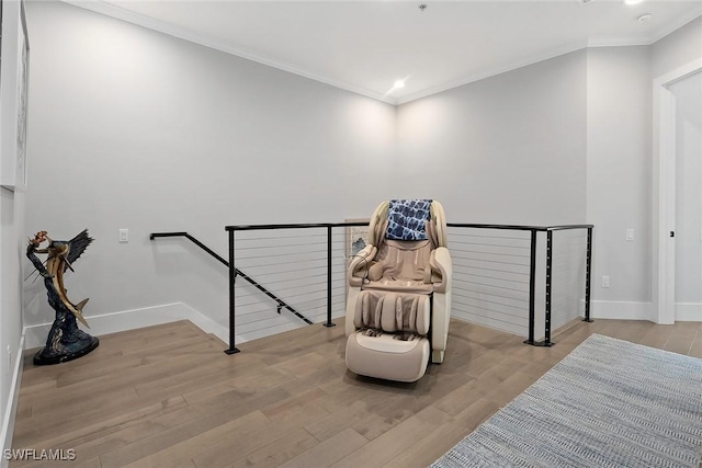 1603 Curlew Ave Unit 1603, Naples, FL 34102 - sitting room with crown molding, baseboards, an upstairs landing, and wood finished floors