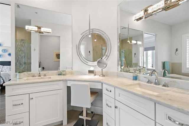 1603 Curlew Ave Unit 1603, Naples, FL 34102 - ensuite bathroom featuring a sink, a stall shower, and double vanity