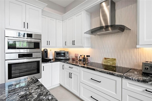 1603 Curlew Ave Unit 1603, Naples, FL 34102 - kitchen featuring a toaster, double oven, black electric stovetop, wall chimney exhaust hood, and white cabinetry