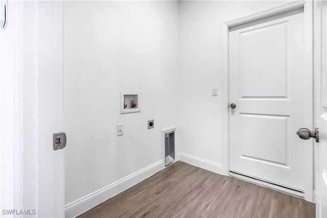 laundry room with hookup for a washing machine, wood finished floors, laundry area, hookup for an electric dryer, and baseboards