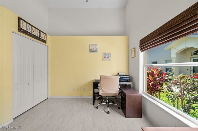 8188 Tauren Ct Unit N342, Naples, FL 34119 - office area featuring a high ceiling and baseboards