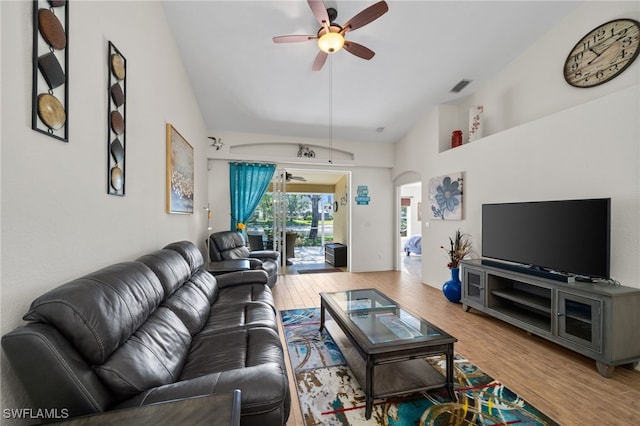 8188 Tauren Ct Unit N342, Naples, FL 34119 - living area with visible vents, arched walkways, vaulted ceiling, wood finished floors, and a ceiling fan