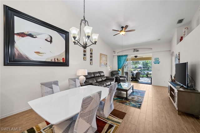 8188 Tauren Ct Unit N342, Naples, FL 34119 - dining room featuring wood finished floors, visible vents, vaulted ceiling, and ceiling fan with notable chandelier