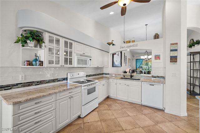 8188 Tauren Ct Unit N342, Naples, FL 34119 - kitchen featuring white appliances, glass insert cabinets, ceiling fan with notable chandelier, backsplash, and a sink