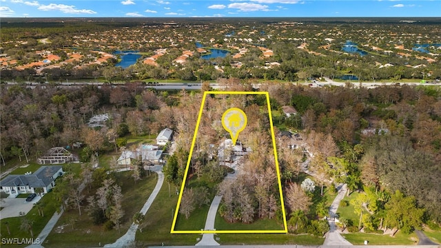 aerial view featuring a water view and a residential view