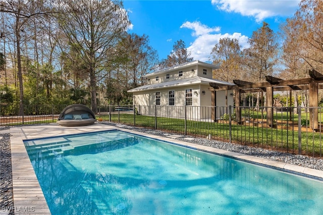 view of swimming pool with a fenced in pool, fence, and a yard