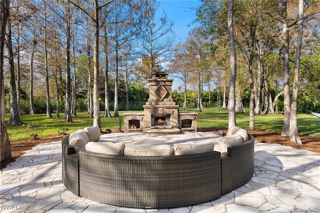 view of patio / terrace with an outdoor stone fireplace