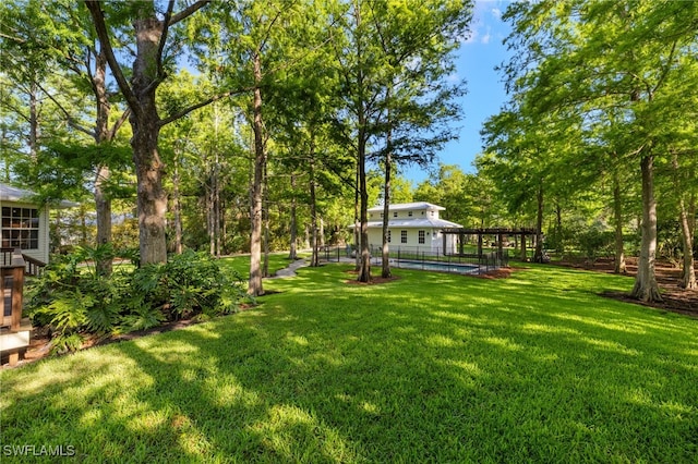 view of yard featuring an outdoor pool
