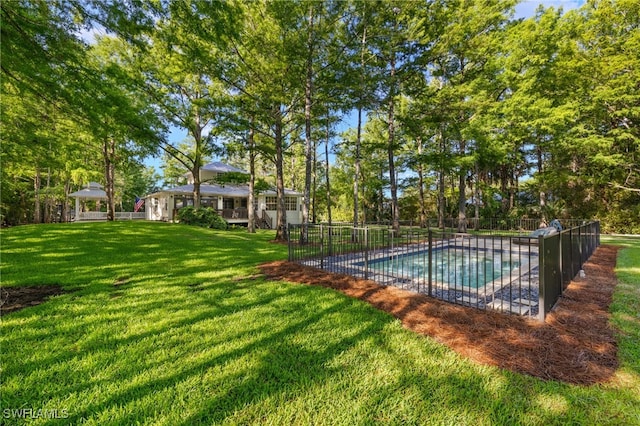 view of pool with a fenced in pool, fence, and a yard