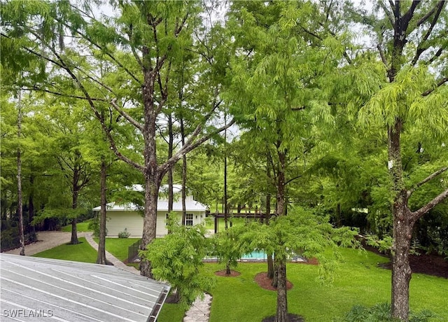 5271 Cherry Wood Dr, Naples, FL 34119 - surrounding community with a lawn