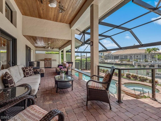 580 Goldcoast Ct, Marco Island, FL 34145 - view of patio featuring an in ground hot tub, a ceiling fan, an outdoor pool, an outdoor hangout area, and a water view