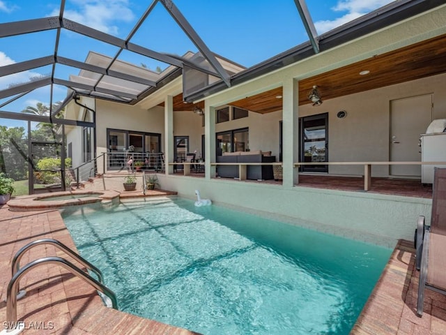 580 Goldcoast Ct, Marco Island, FL 34145 - view of pool with glass enclosure, a patio, and a pool with connected hot tub