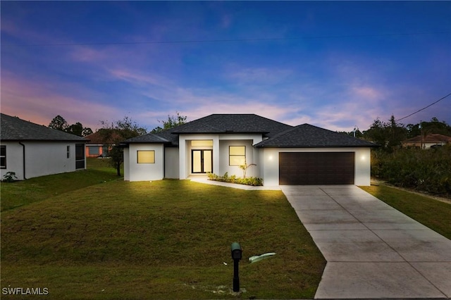 2706 39th St W, Lehigh Acres, FL 33971 - prairie-style home featuring a shingled roof, a yard, stucco siding, concrete driveway, and an attached garage