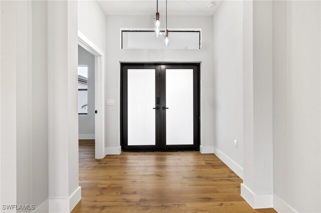 2706 39th St W, Lehigh Acres, FL 33971 - foyer entrance featuring wood finished floors and baseboards