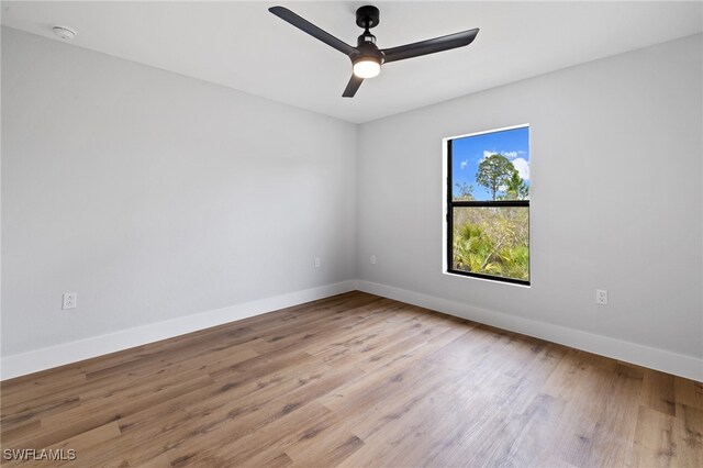 2706 39th St W, Lehigh Acres, FL 33971 - unfurnished room featuring ceiling fan, wood finished floors, and baseboards