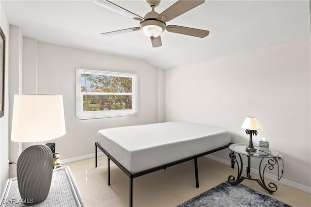 bedroom featuring baseboards, a ceiling fan, and vaulted ceiling