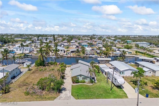 bird's eye view featuring a water view and a residential view