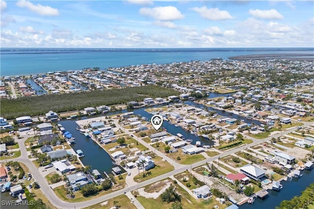 drone / aerial view featuring a water view and a residential view