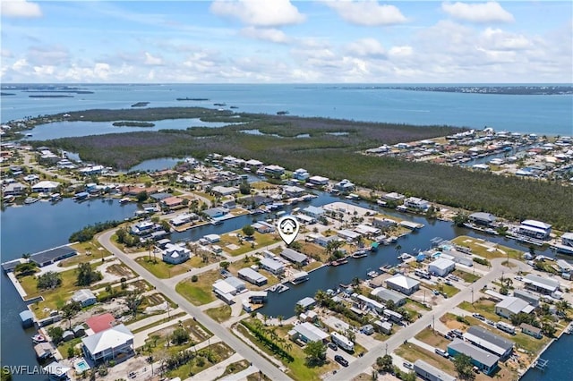 birds eye view of property featuring a residential view and a water view
