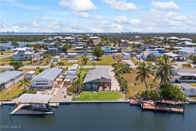 bird's eye view featuring a water view and a residential view