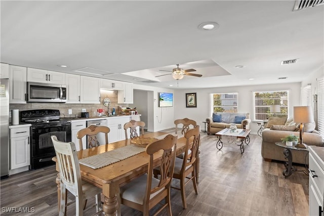 dining space featuring recessed lighting, a ceiling fan, dark wood-style floors, and visible vents