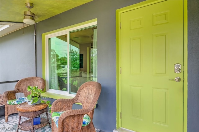view of exterior entry with stucco siding