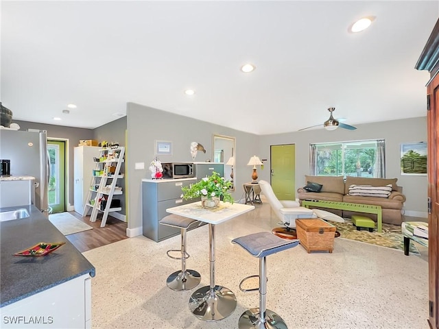 playroom with baseboards, recessed lighting, and ceiling fan