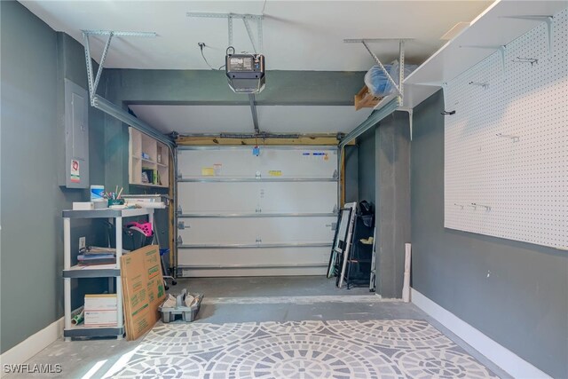 garage with a garage door opener and baseboards