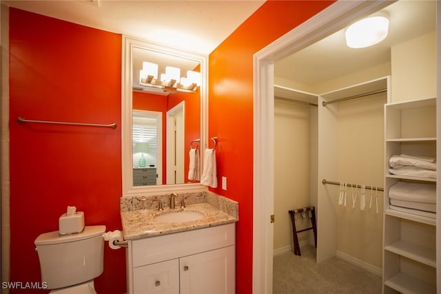 bathroom with toilet and vanity