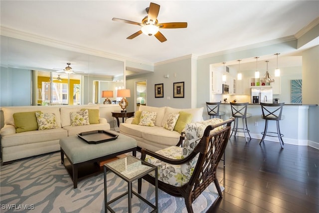 living area featuring ornamental molding, ceiling fan, and plenty of natural light