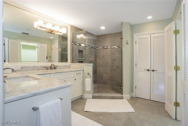 full bathroom featuring recessed lighting, a stall shower, a closet, and vanity