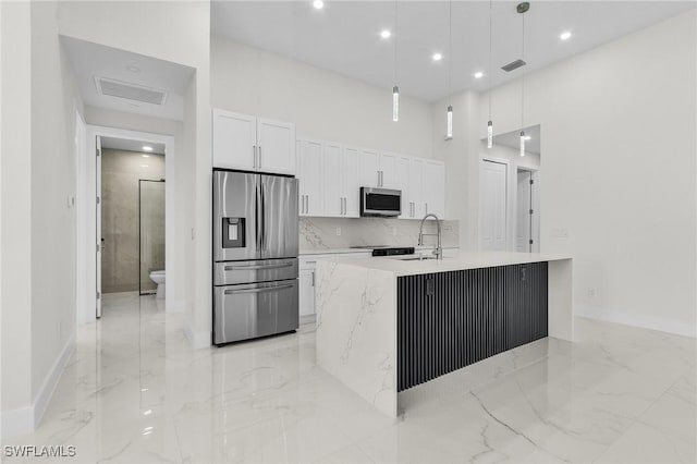 806 Santa Barbara Blvd, Cape Coral, FL 33991 - kitchen featuring marble finish floor, a sink, white cabinetry, and stainless steel appliances