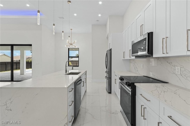 806 Santa Barbara Blvd, Cape Coral, FL 33991 - kitchen featuring a sink, appliances with stainless steel finishes, recessed lighting, a wealth of natural light, and marble finish floor