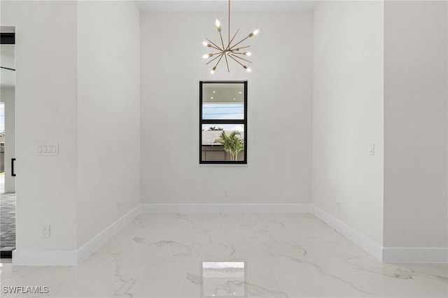 806 Santa Barbara Blvd, Cape Coral, FL 33991 - empty room featuring marble finish floor, a chandelier, and baseboards
