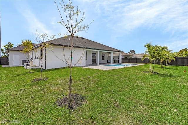 806 Santa Barbara Blvd, Cape Coral, FL 33991 - back of house featuring stucco siding, a yard, a patio area, and a fenced backyard