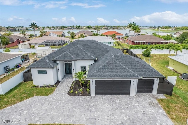 806 Santa Barbara Blvd, Cape Coral, FL 33991 - ranch-style house with stucco siding, decorative driveway, fence, and an attached garage
