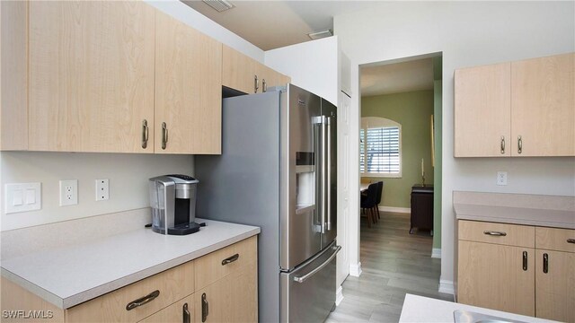 761 Grand Rapids Blvd, Naples, FL 34120 - kitchen featuring light brown cabinets, stainless steel fridge, and light wood-type flooring