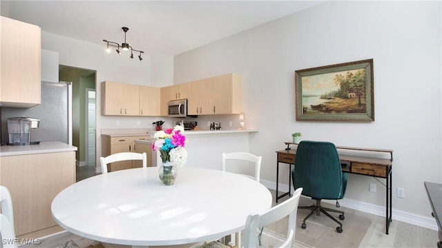 761 Grand Rapids Blvd, Naples, FL 34120 - dining area featuring baseboards and light wood-style floors