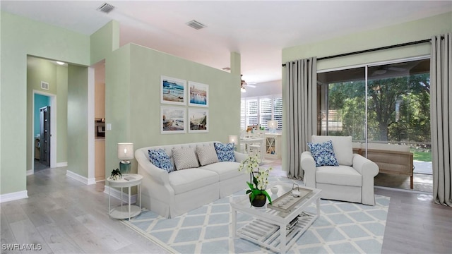 761 Grand Rapids Blvd, Naples, FL 34120 - living room with wood finished floors, a ceiling fan, and baseboards