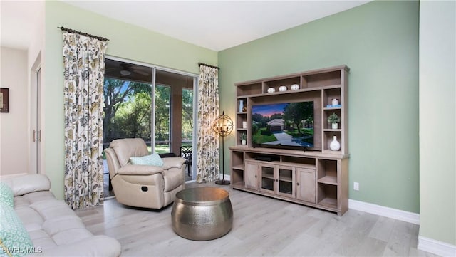 761 Grand Rapids Blvd, Naples, FL 34120 - living area with wood finished floors, baseboards, and ceiling fan