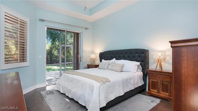 761 Grand Rapids Blvd, Naples, FL 34120 - bedroom with access to exterior, dark wood-style floors, and baseboards